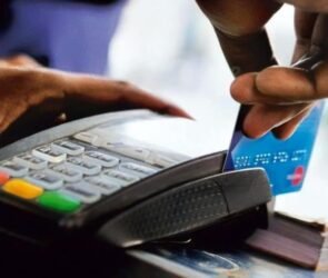 A Point-of-Service Machine with an ATM Card during a transaction.