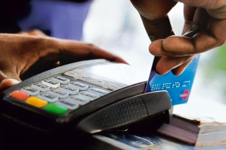 A Point-of-Service Machine with an ATM Card during a transaction.