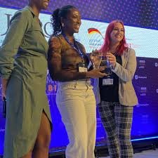 Representative of  Mini-Pay receiving an award at the ATS 2025  held at Nairobi 