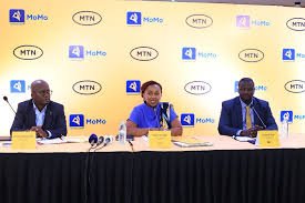 Two men at each side with a woman at the middle, CEO MTN Uganda Mulinge