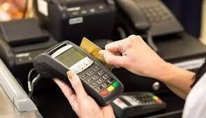 A human being operating a POS Mcahine