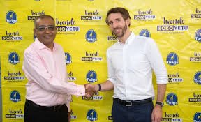 Two men shaking hands at the acquisition of the three fmcgg by twiga