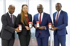 An image of UBA stakeholders and staff holding the upgraded terminal points machine-PoS