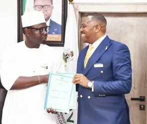 An image of Minister Ayodele Olawande and Dr Enefola Odiba