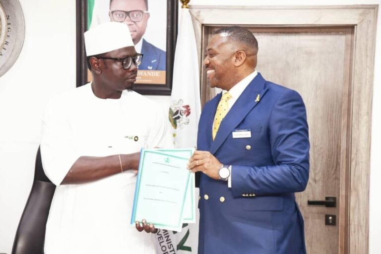 An image of Minister Ayodele Olawande and Dr Enefola Odiba