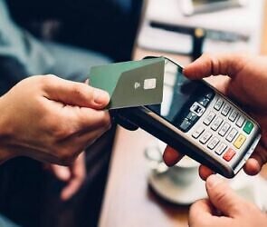 An image of someone holding POS