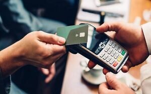 An image of someone holding POS