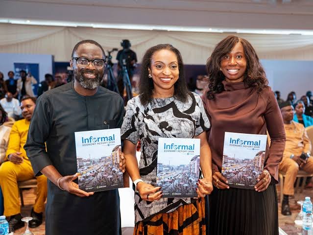 Woman and Man holding a magazine of Moniepoint